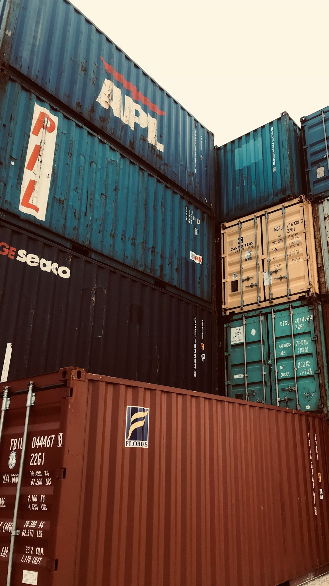 a-bunch-of-cargo-containers-stacked-on-top-of-each-other-v0xddz62ei0
